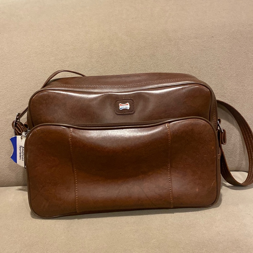Vintage American Tourister brown shoulder bag.  Front zipper pocket & large main